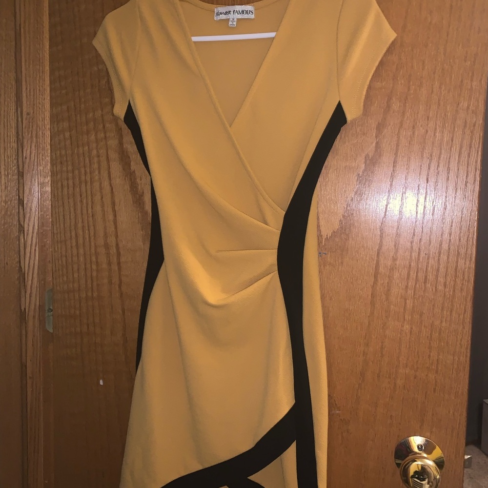 This mustard colored bodycon dress has only been worn once!
